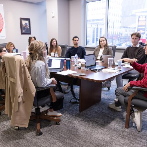 People sitting around a table in a meeting